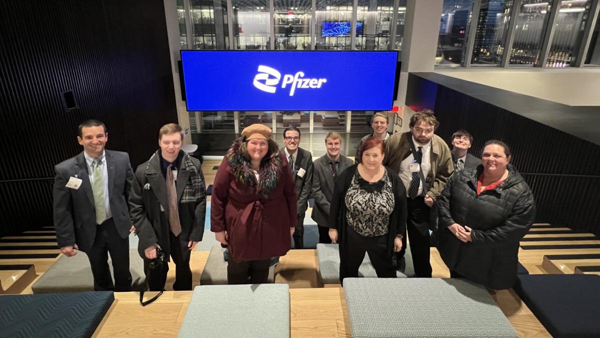 AIM students posing for a group photo at Pfizer