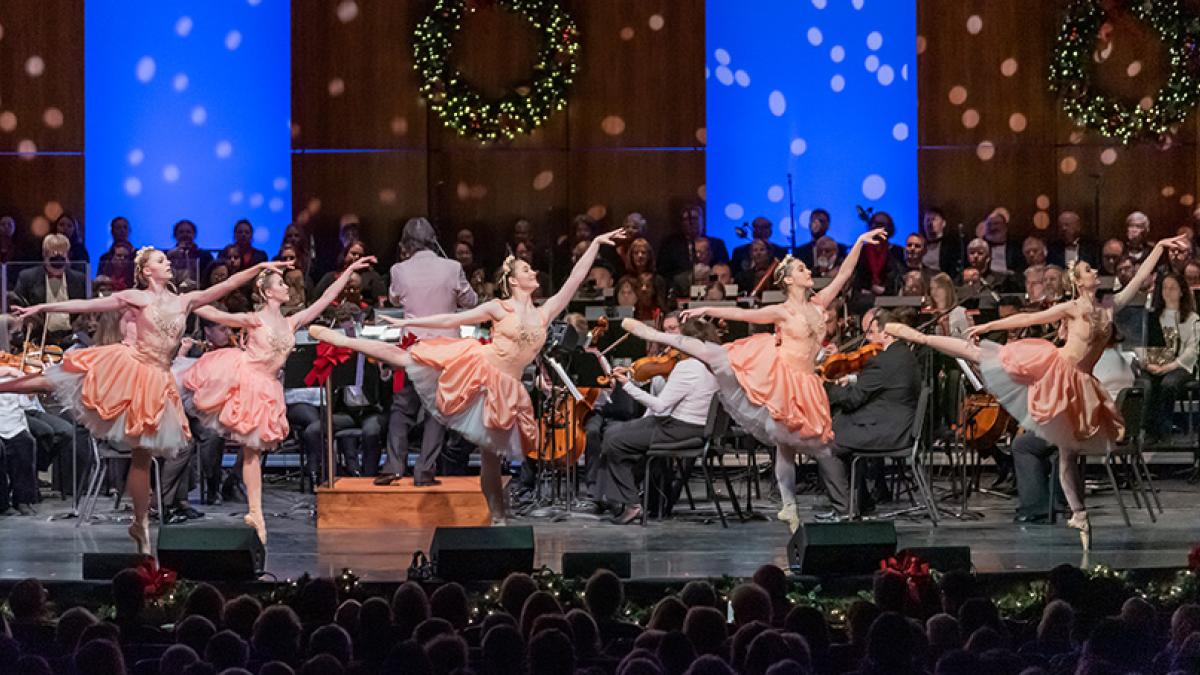 Ballets and musicians performing 'Tis the Season on stage