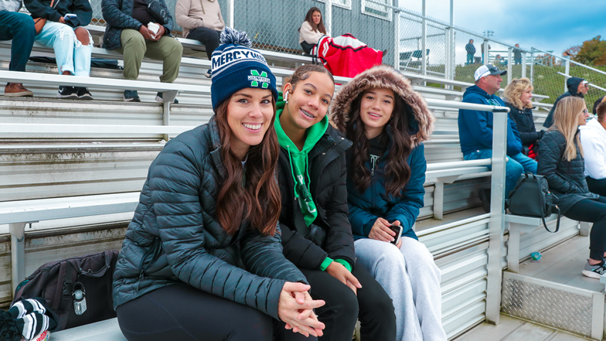 Homecoming 2023, girls sitting on bleachers