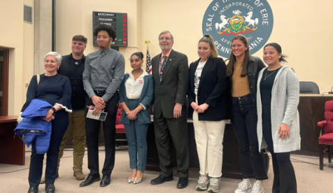 Social Determinants of Health students posing for a photo at a Erie City Council meeting