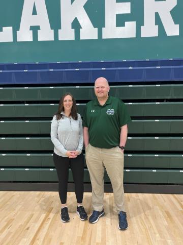 Jenell and Ryan posing for a picture in the gym