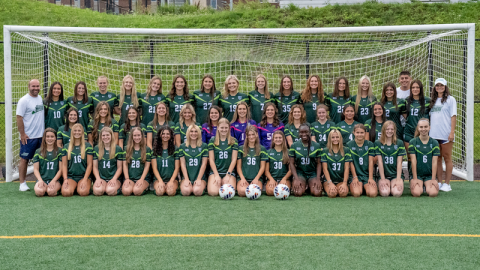 Picture of Mercyhurst's women's soccer team, posing in front of a goal