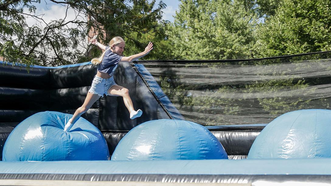 2024 girl on inflatable dome during afternoon games