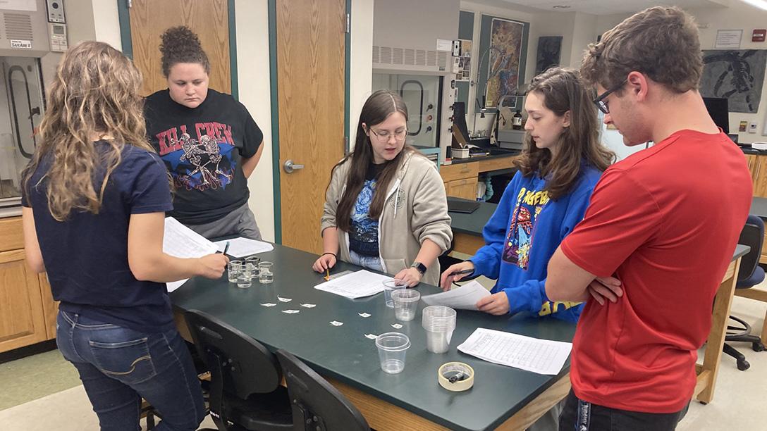 Geology students indoors in a lab