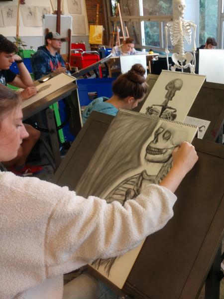 art students sketch skeletons